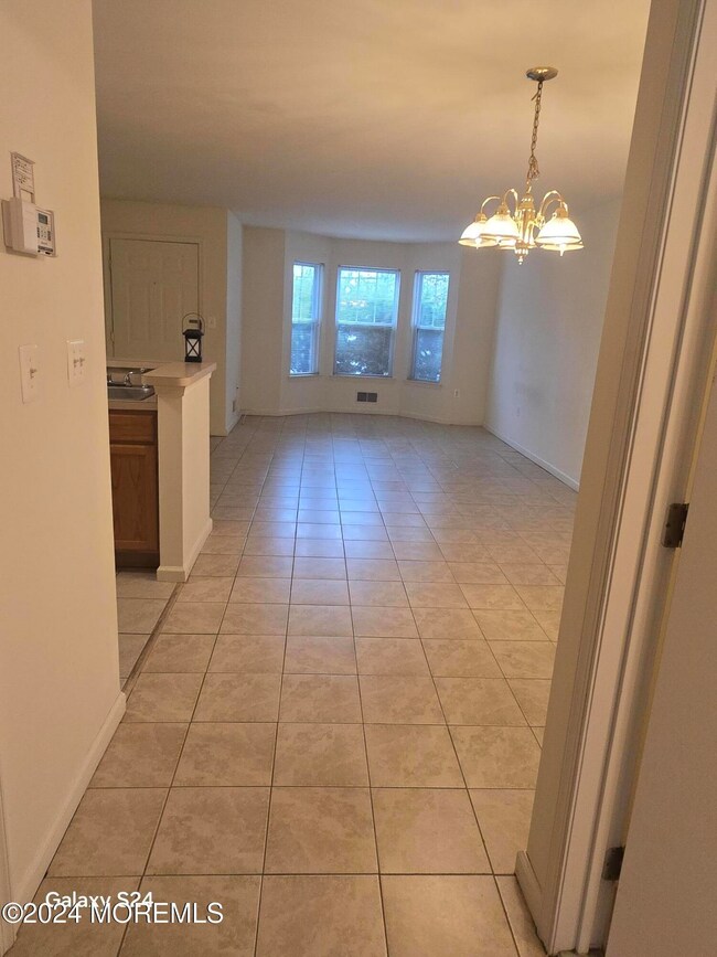 Large tiled open space DR to LR front wi