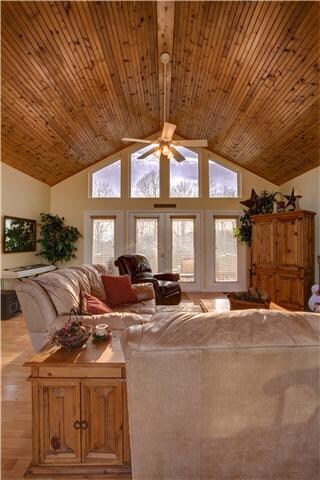 Enter the beautiful great room.  Notice the windows for east and western views and  the tongue and groove ceiling!
