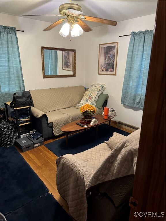 One of three bedrooms featuring wood-type flooring