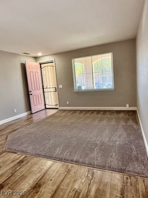 Entrance foyer with baseboards and light wood finished floors