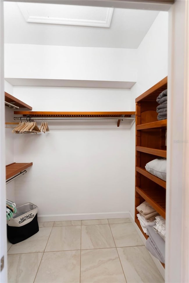 Primary bedroom walk in closet