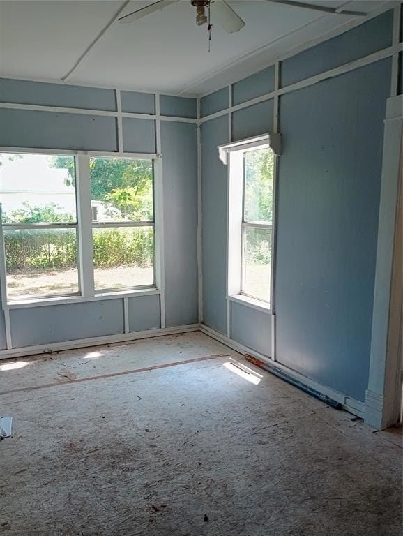 Spare room with a ceiling fan