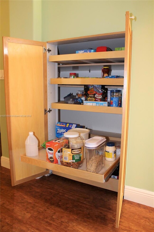 This built-in wall pantry also has pullout shelves like many of the other kitchen cabinets.