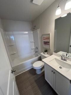 Full bathroom featuring toilet, shower / tub combi