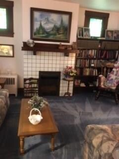 Living Room showing fireplace and bookcase