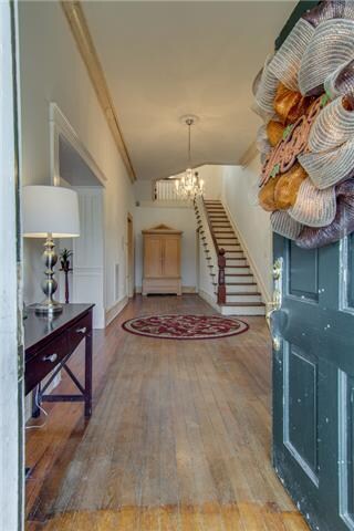  You cant help but feel Welcome  as you walk into this very elegant and spacious  front foyer displaying the beautiful Chandler and Staircase.  