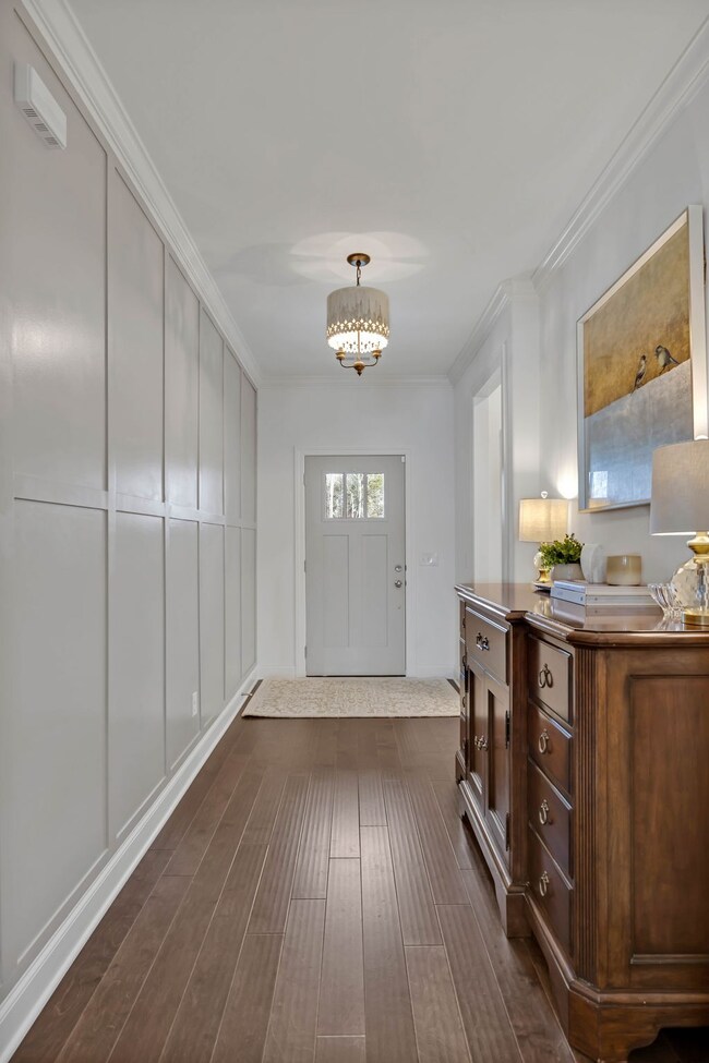 This shot further accentuates the pretty, painted board and batten accent wall to the left; a nice improvement recently made by the owners of this lovely home!