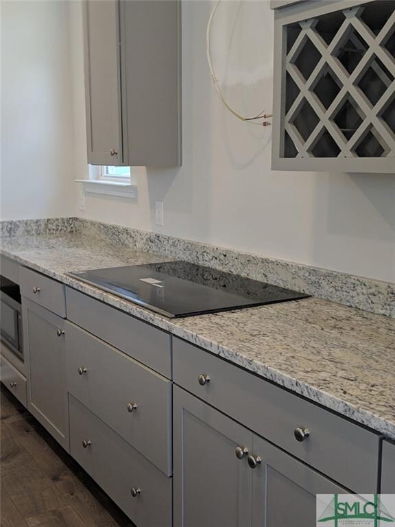 Wine rack and drop in stove top. Beautiful range h
