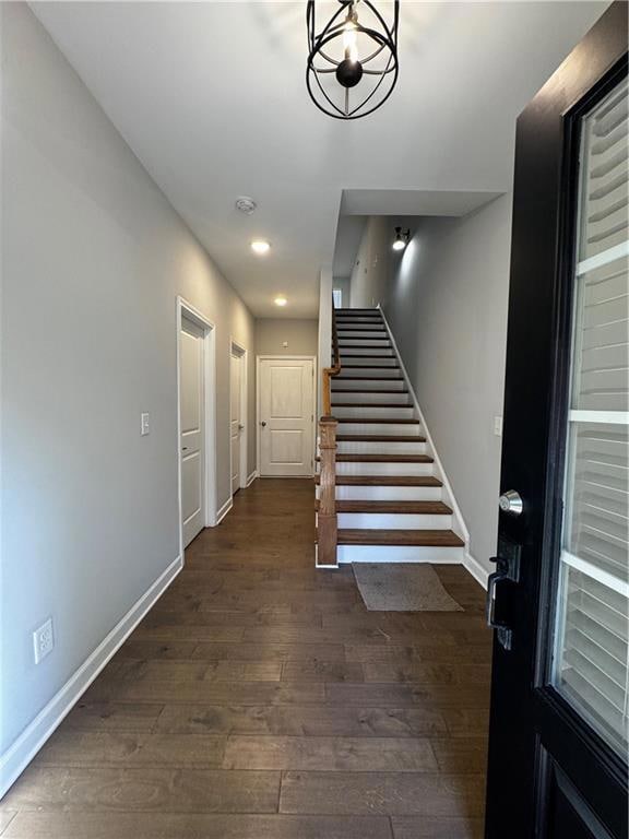Stairs featuring wood-type flooring and recessed lighting
