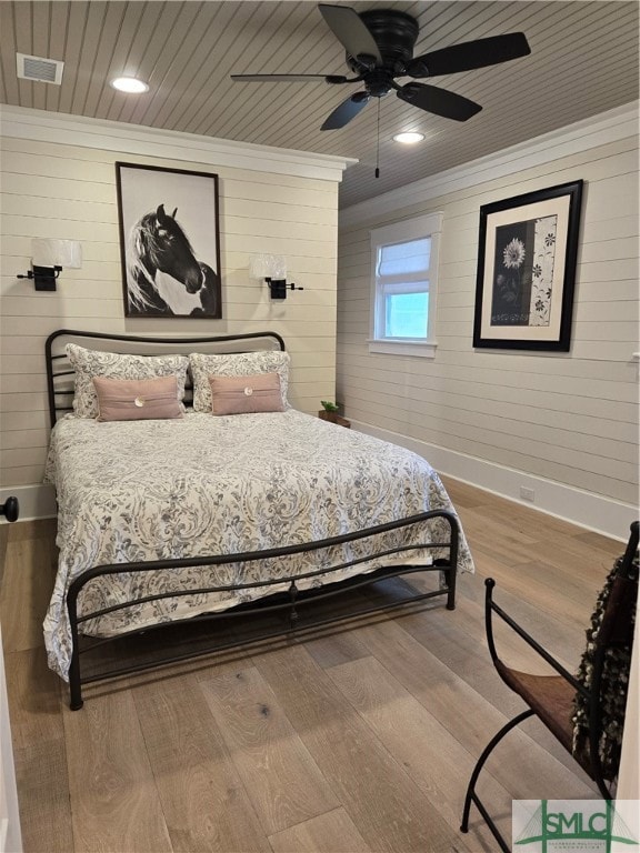 Queen iron bed, armoire.
Sconces over headboard.