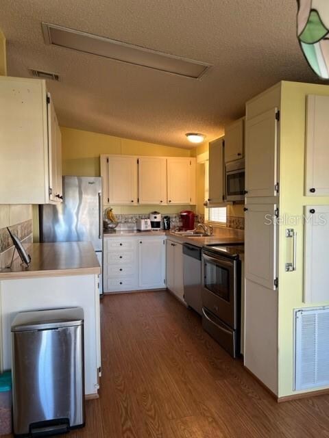 KITCHEN, PANTRY ON RIGHT WITH LOTS OF STORAGE CABINETS ON LEFT