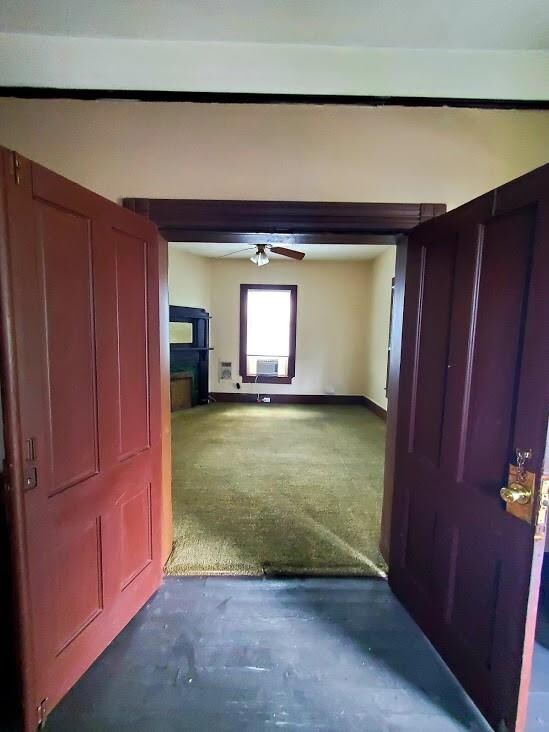 Downstairs double doors entrance into living room.
