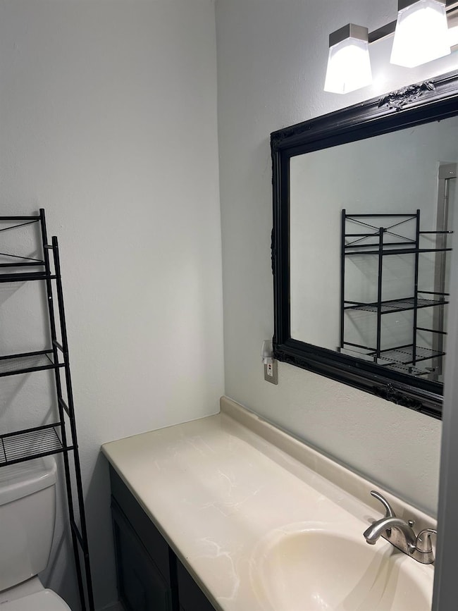 Bathroom with vanity and toilet