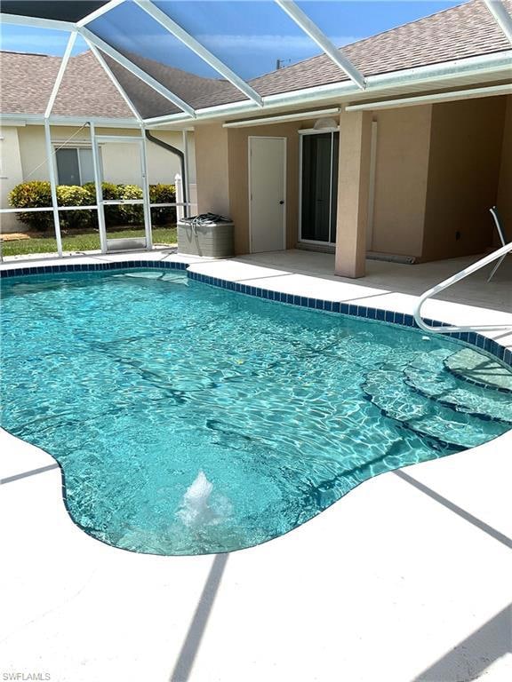 Swimming pool with a patio area and a lanai