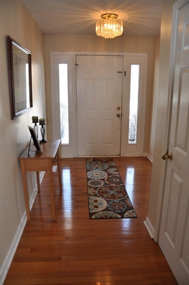 Beautiful hardwood floors greet you as you enter t