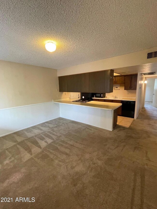 Kitchen from dining-fam rm area