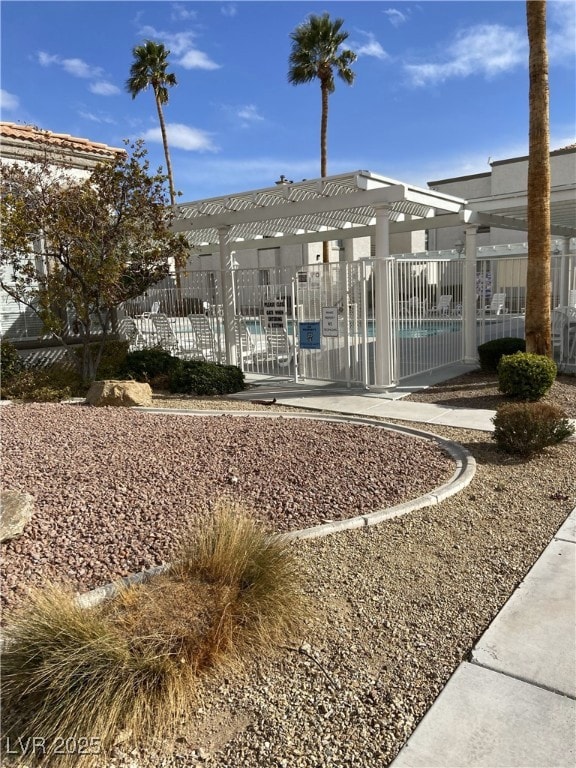 View of home's community with a pergola and a swim