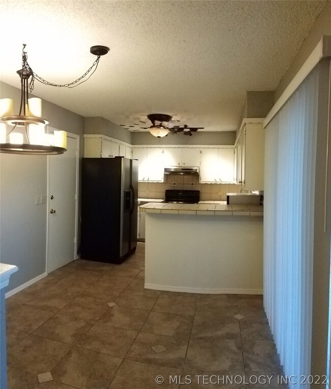 Dining Area Features Breakfast Bar .  Spacious Scr