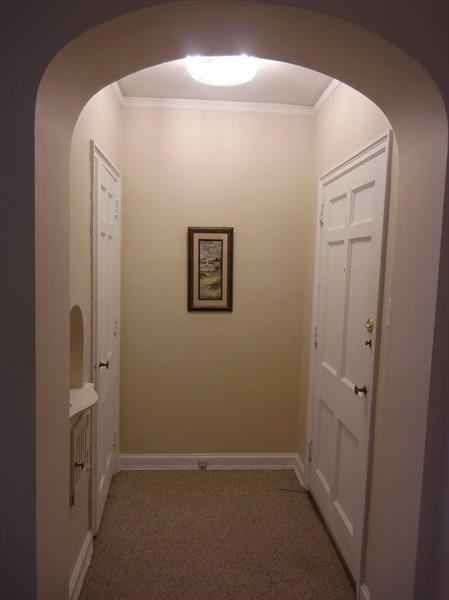 Entrance, door to right, large coat closet to left