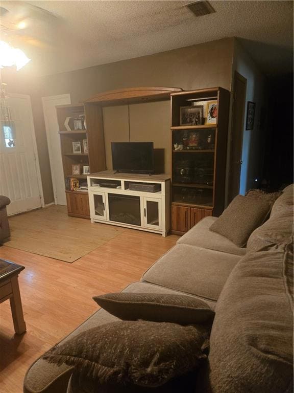Living room with light wood-style flooring