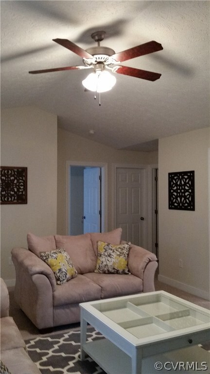 Cathedral ceiling and beautiful ceiling fan make t