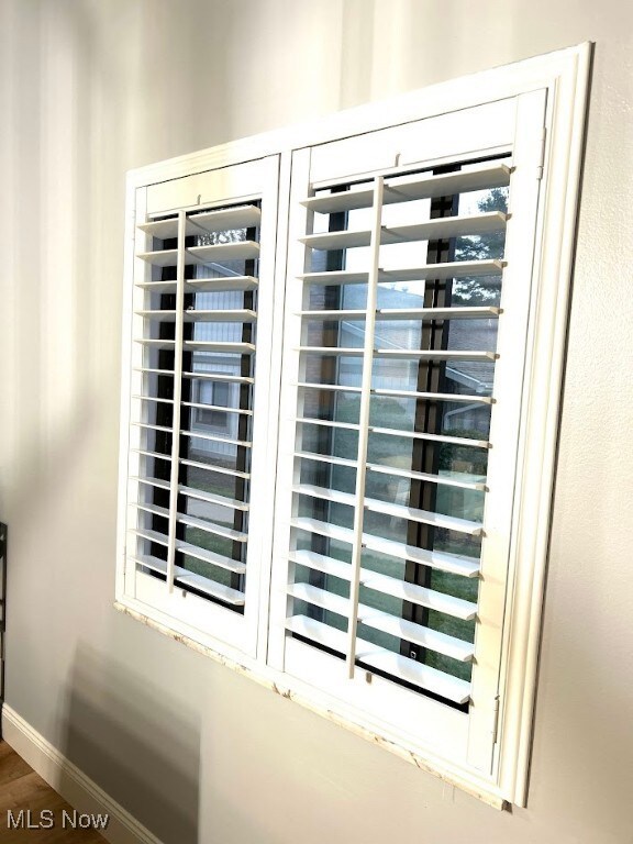 Detailed view of wine cooler and baseboards