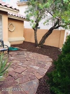 Front behind shrubbery