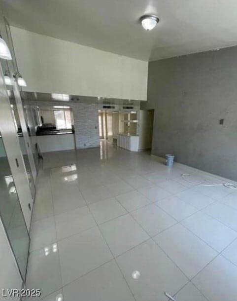 Unfurnished living room with light tile patterned