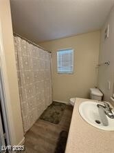 Bathroom featuring a shower with shower curtain, vanity, and mail area