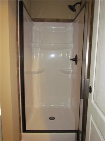 Shower with door in master bath.