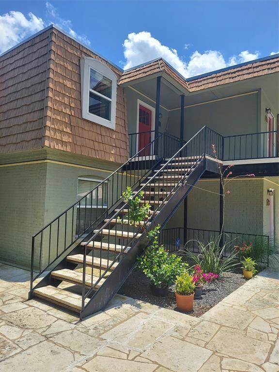 Entrance to property with mansard roof