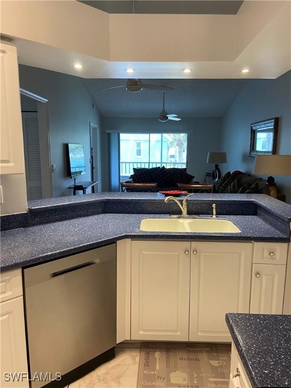 Kitchen with dishwasher, a sink, open floor plan,