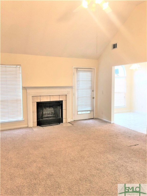 Living room opens into the the eat in kitchen and