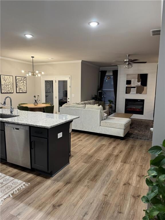 Kitchen featuring pendant lighting, sink, dishwash