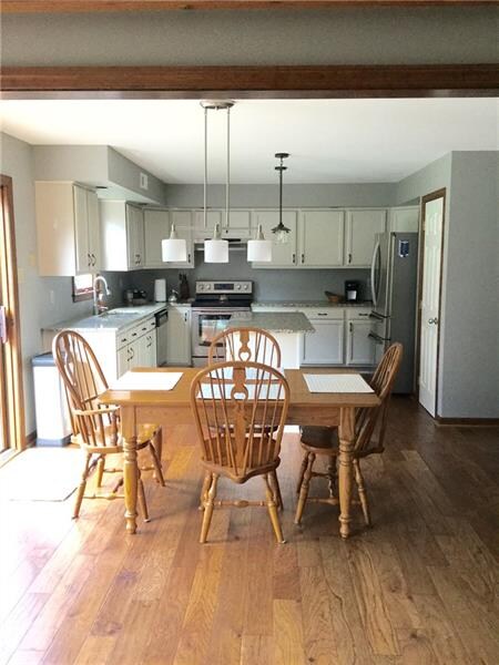 Gorgeous all updated Kitchen with great Counter Space and Providing Dining Area as well.
