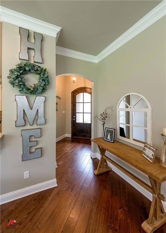 Wood floors welcome you throughout the entry, livi