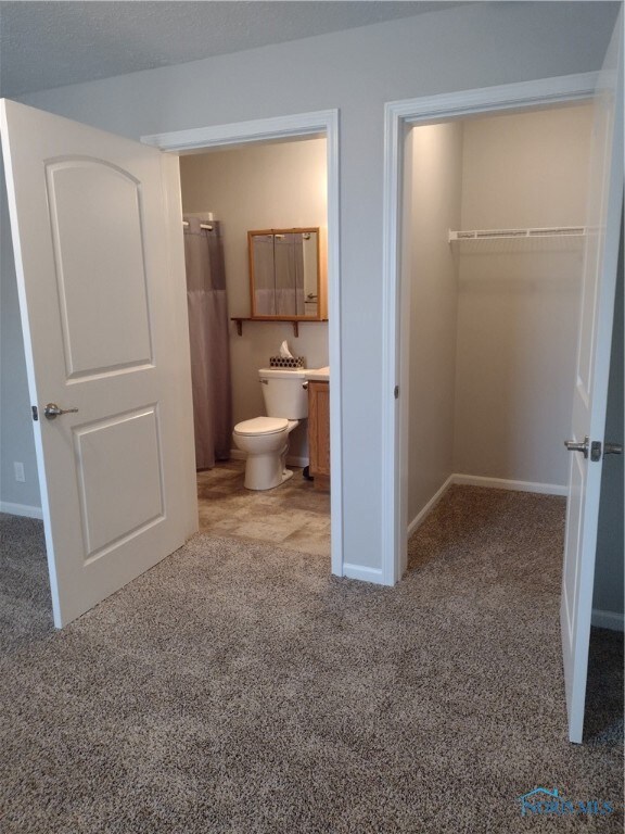 Primary bathroom and walk in closet.