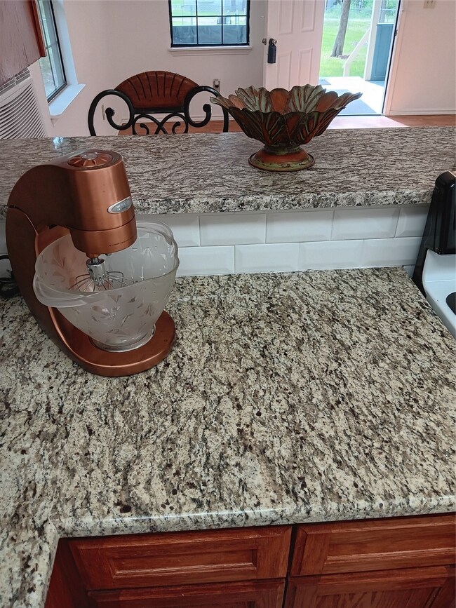 Pretty counter tops, deep stainless steel sink
