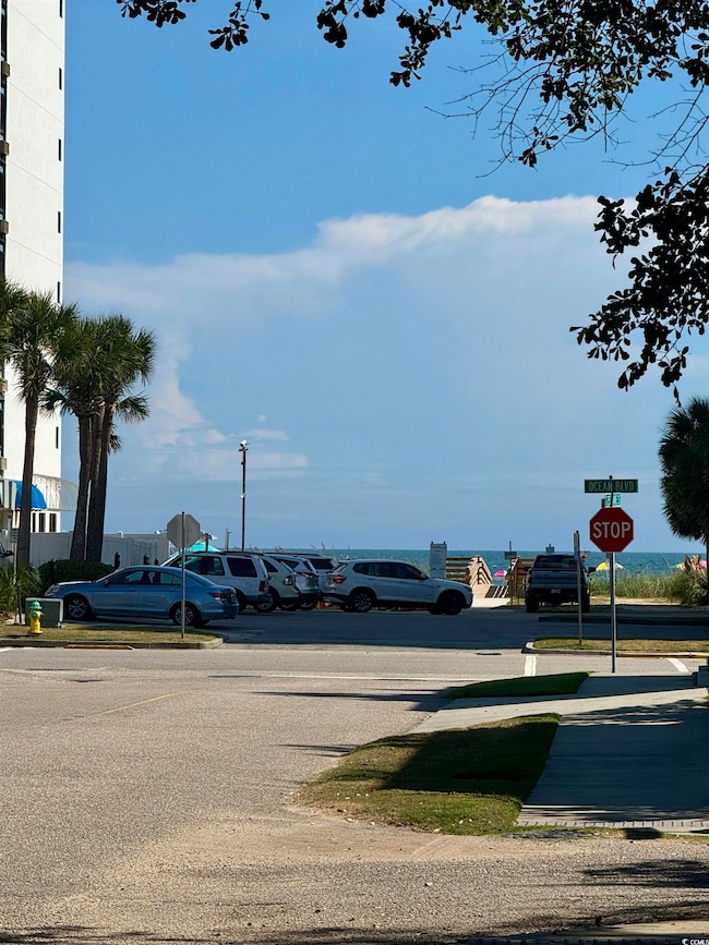 View of asphalt road with traffic signs