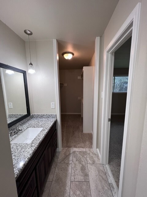 Primary bath  leading to walk in closet