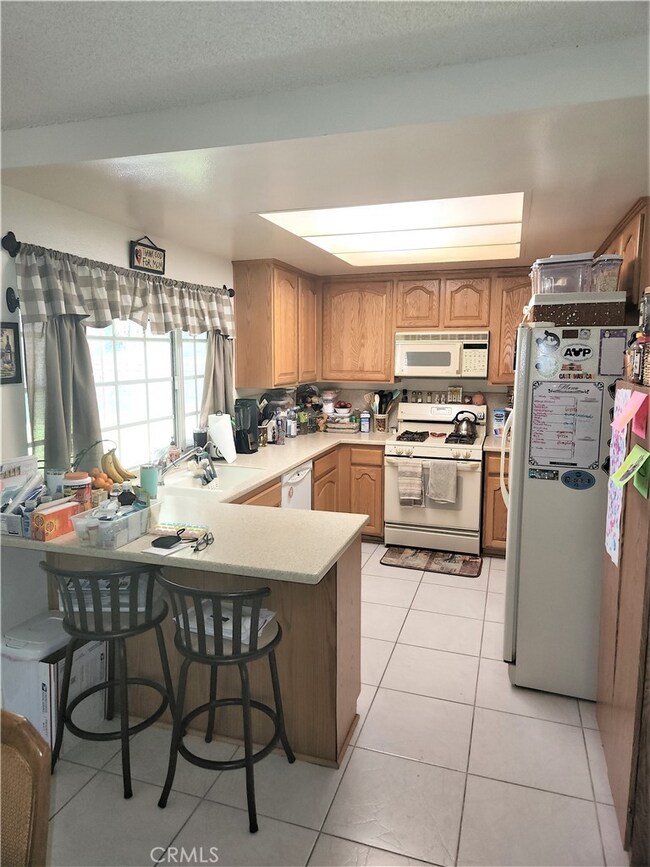 Kitchen w/ Eat in Bar