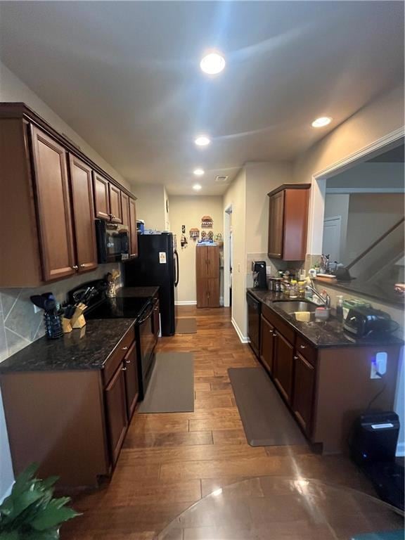 Kitchen featuring range, dark wood-style floors, d