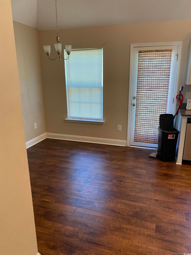 Interior space featuring dark hardwood / wood-styl