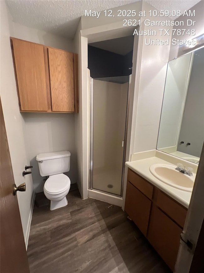 Bathroom featuring wood finished floors, vanity, 