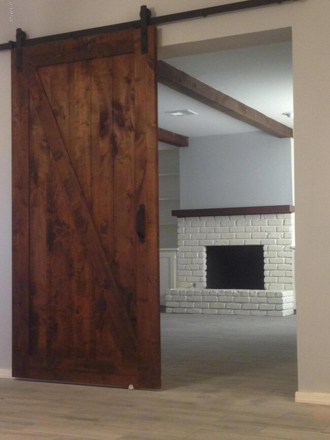 Barn door Fireplace bedroom