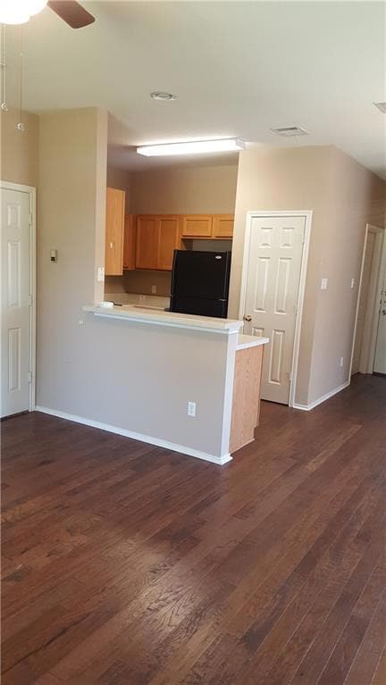 Kitchen featuring freestanding refrigerator, ligh