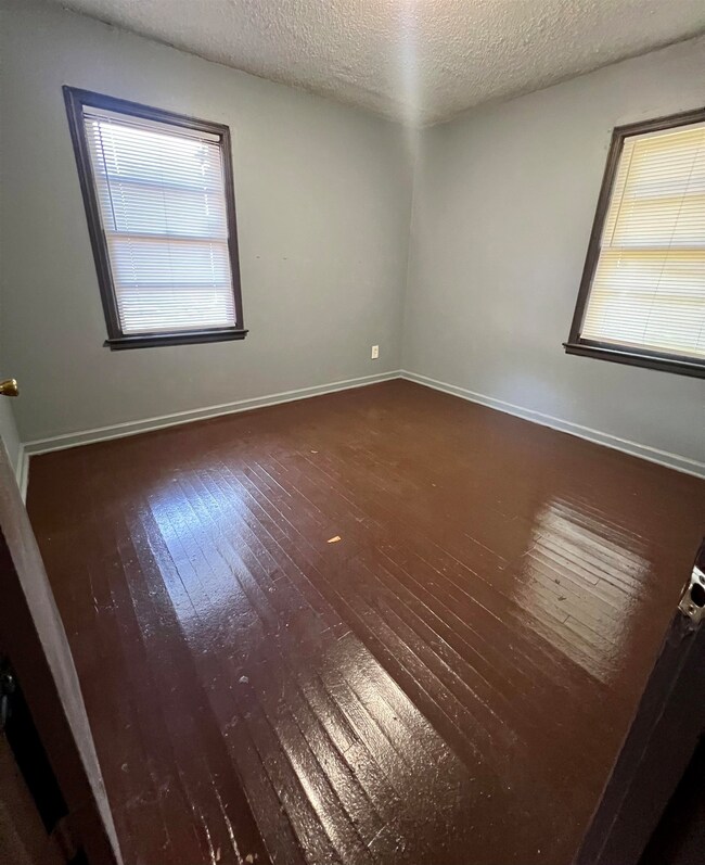 Spare room with a wealth of natural light, a textu