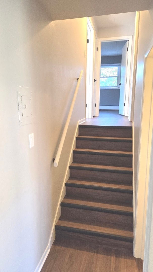 Stairs leading up to both bedrooms and one of the