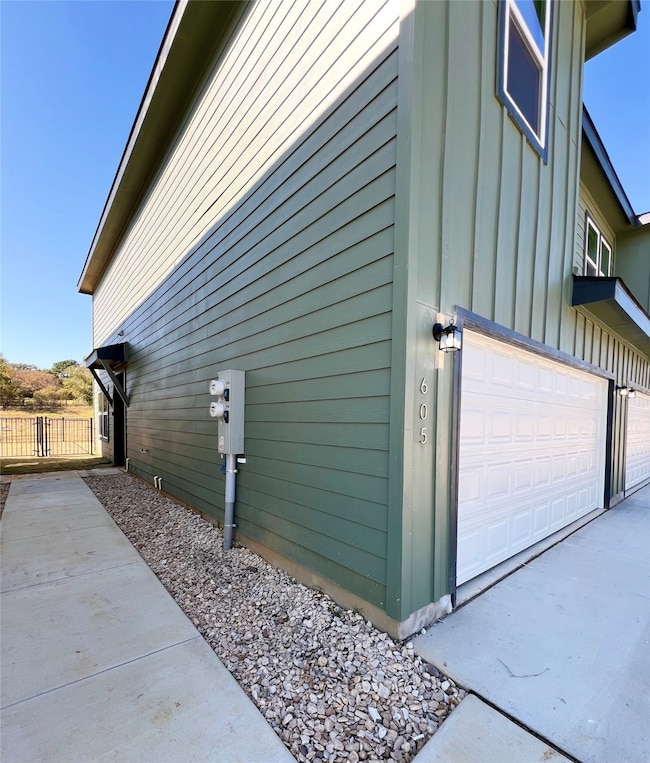 View of property exterior featuring board and batten siding