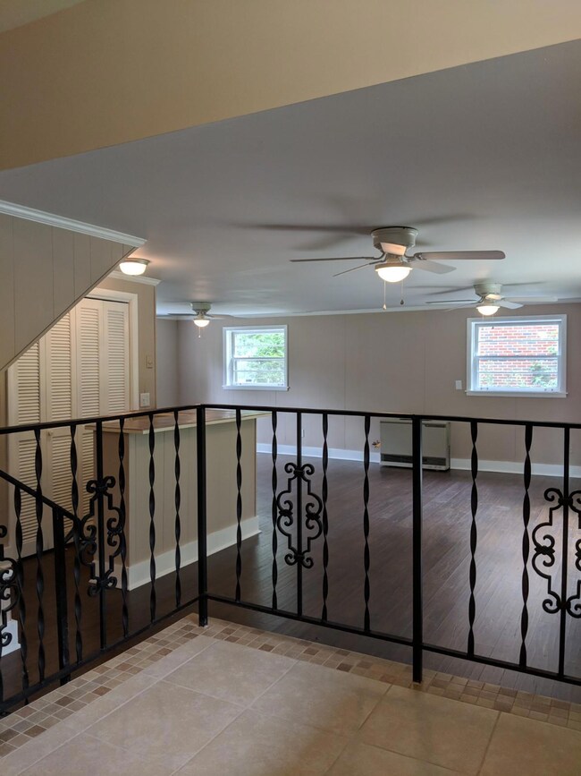 The eating area and kitchen are elevated from the family room.